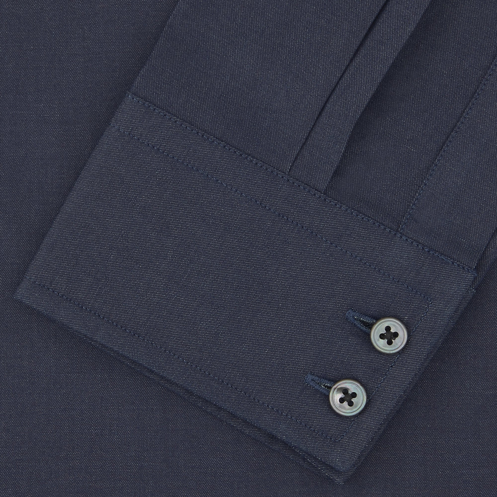 A neatly folded Tailored Fit Navy Cashmere Blend Shirt with a Kent collar and 2-button cuffs by Turnbull & Asser is shown on a plain white background.