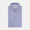 View 1 of product The Turnbull & Asser Tailored Fit Blue Fine Bengal Stripe Cotton Shirt features a Kent collar, double cuffs, and thin white stripes. Displayed neatly folded against a white background.