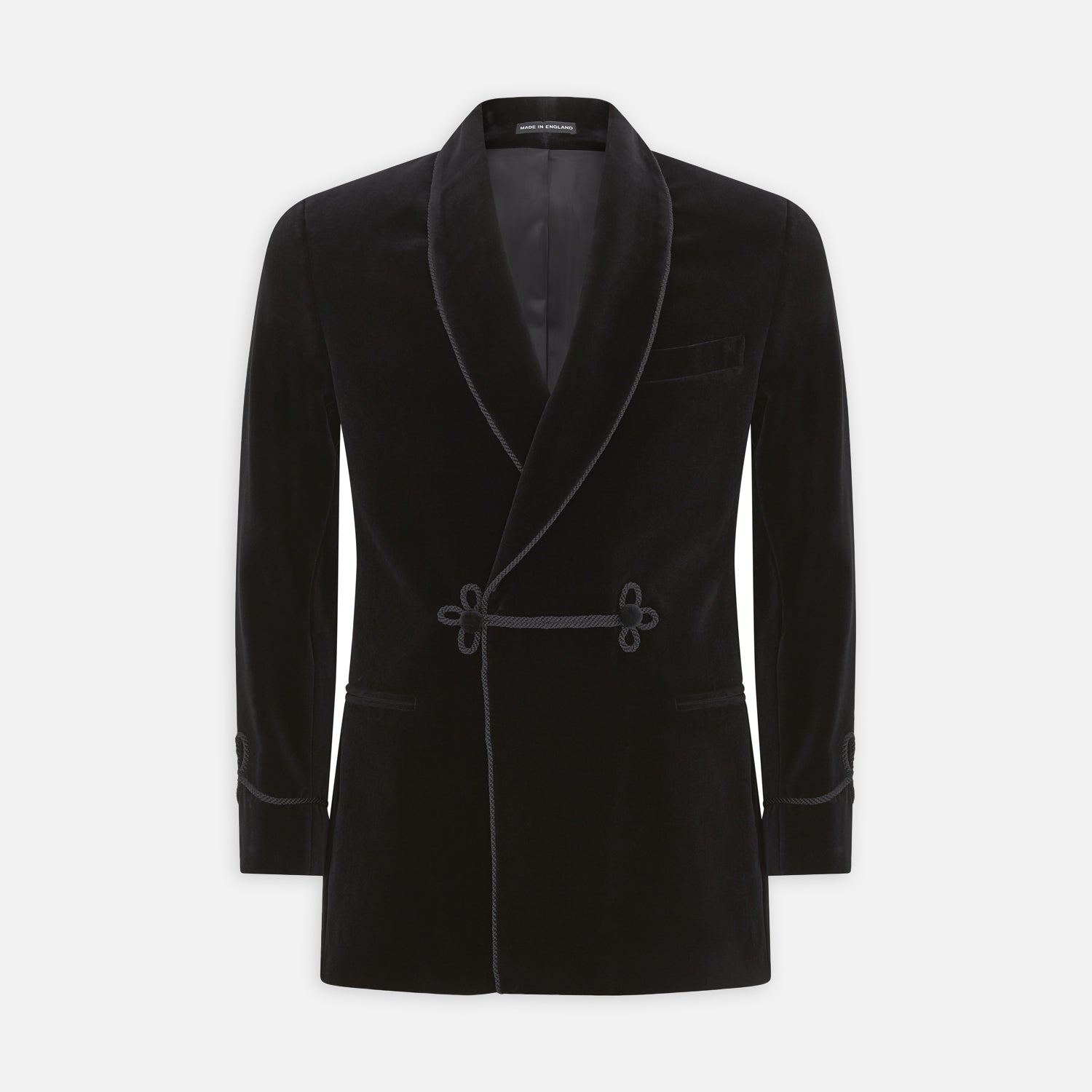 View 1 of product The Turnbull & Asser Black Double Breasted Velvet Smoking Jacket features a shawl collar, decorative frogging closure, and subtle piping on cuffs and edges, ideal for eveningwear and shown against a plain white background.
