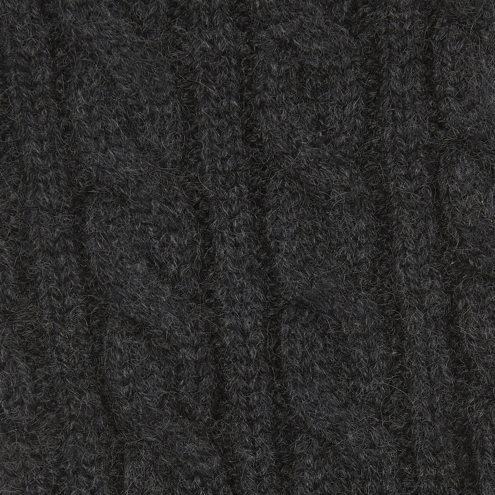 A Charcoal Cable Knit Cashmere Sock by Turnbull & Asser, featuring a ribbed cuff, is shown against a plain white background.
