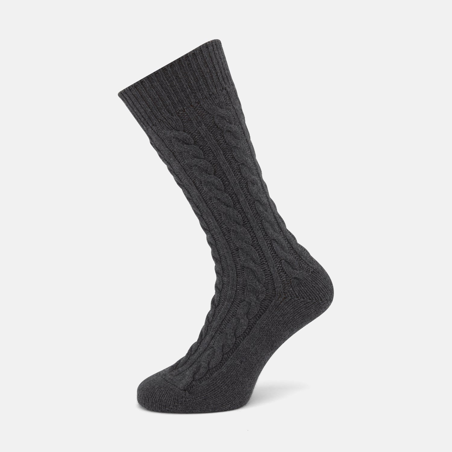 View 1 of product The Dark Grey Cashmere Cable-Knit Sock by Turnbull & Asser stands upright against a white background, featuring a mid-calf length, ribbed cuff, and thick cable-knit design for a luxurious, premium feel.