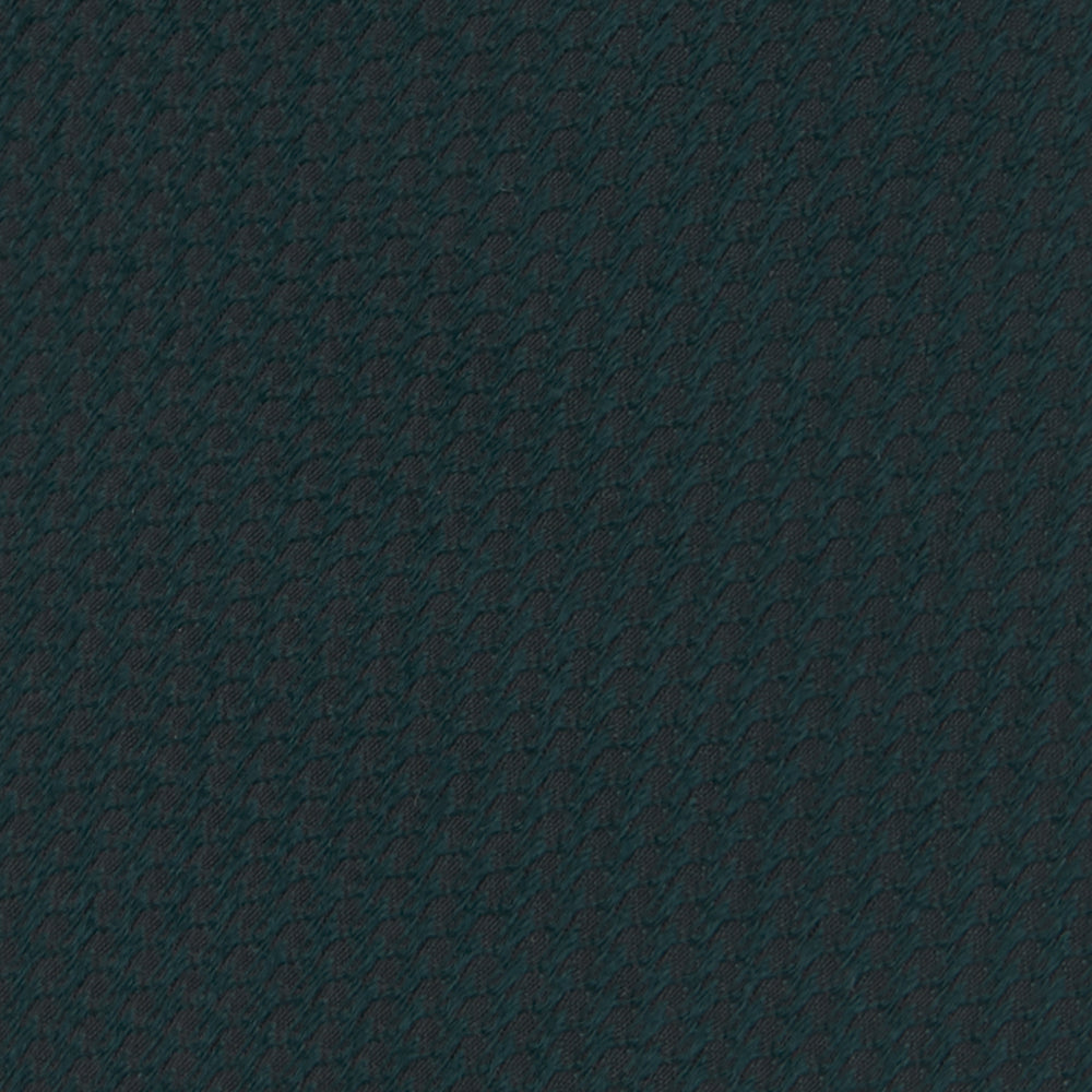 The Turnbull & Asser Forest Green Lace Silk Tie, shown rolled on a white background, features a lace weave texture and brings versatile style to any wardrobe.