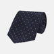 The Turnbull & Asser Navy and Gold Spot Lace Silk Tie, ideal for office wear, is shown rolled up on a white background.