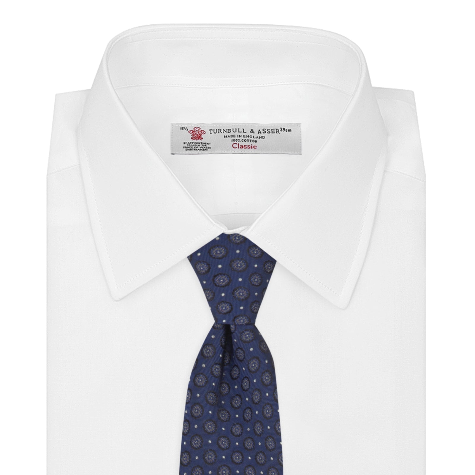 View 2 of product The Turnbull & Asser Navy Floral Spot Silk Tie, featuring a subtle light blue and gray pattern, is rolled up against a plain white background—an ideal accessory for any office shirt.
