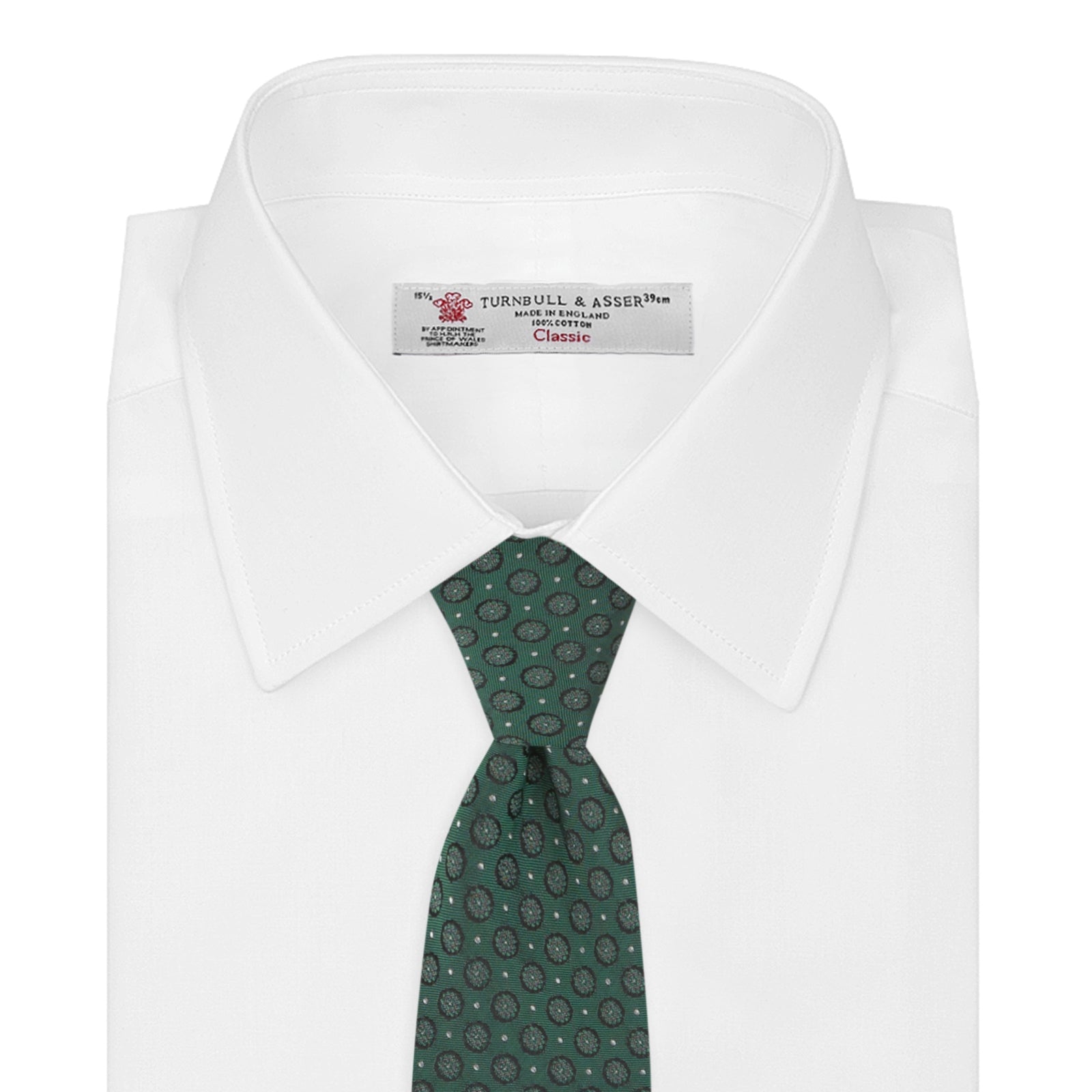 View 2 of product The Turnbull & Asser Green Floral Spot Silk Tie features small, light-colored circular dots on a classic green silk background—ideal for dressing up your favorite office shirt. Displayed rolled on a plain white backdrop.