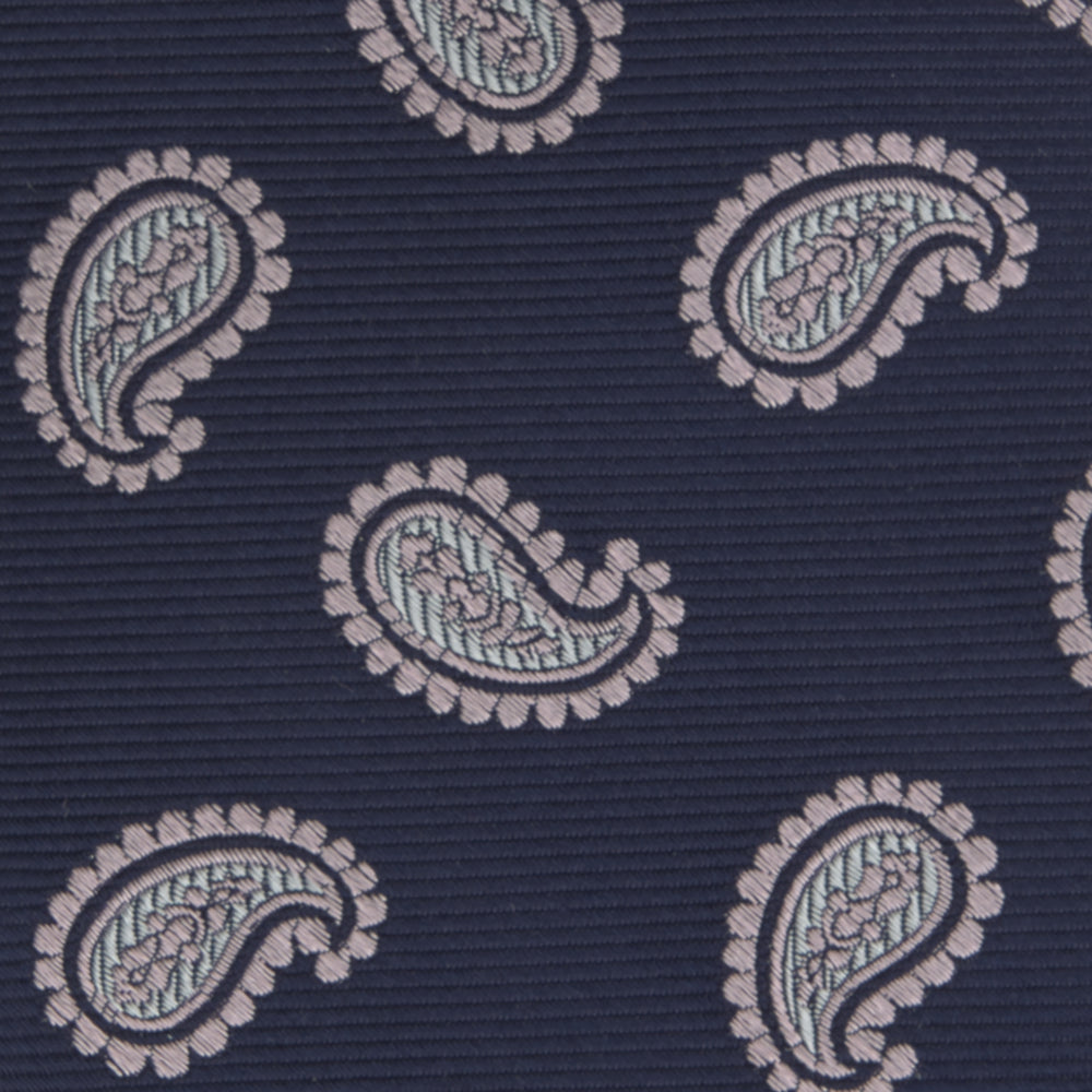 The Turnbull & Asser Navy and Light Pink Floating Paisley Silk Tie features a classic pink and white paisley pattern—a timeless accessory to enhance any wardrobe.