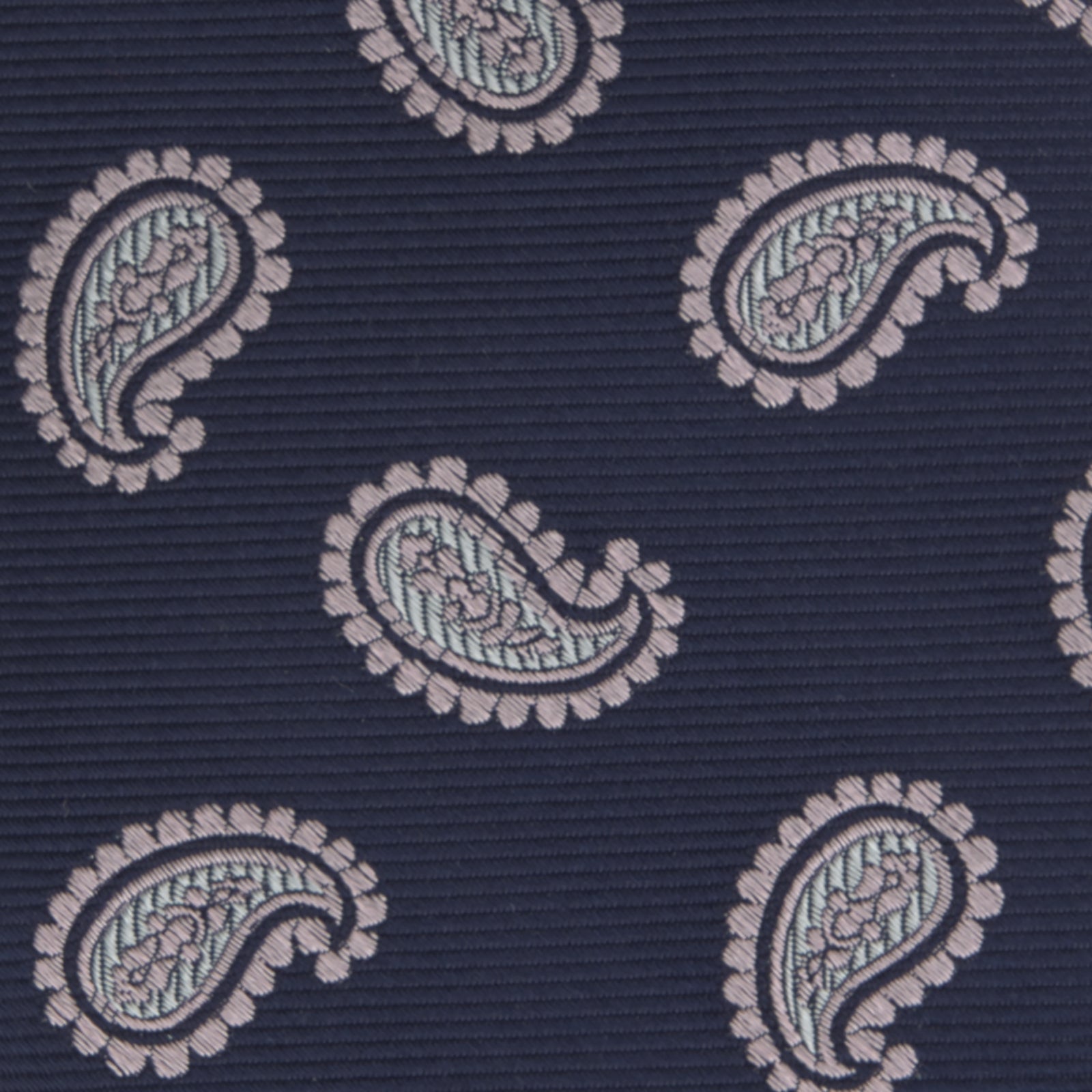 View 3 of product The Turnbull & Asser Navy and Light Pink Floating Paisley Silk Tie features a classic pink and white paisley pattern—a timeless accessory to enhance any wardrobe.