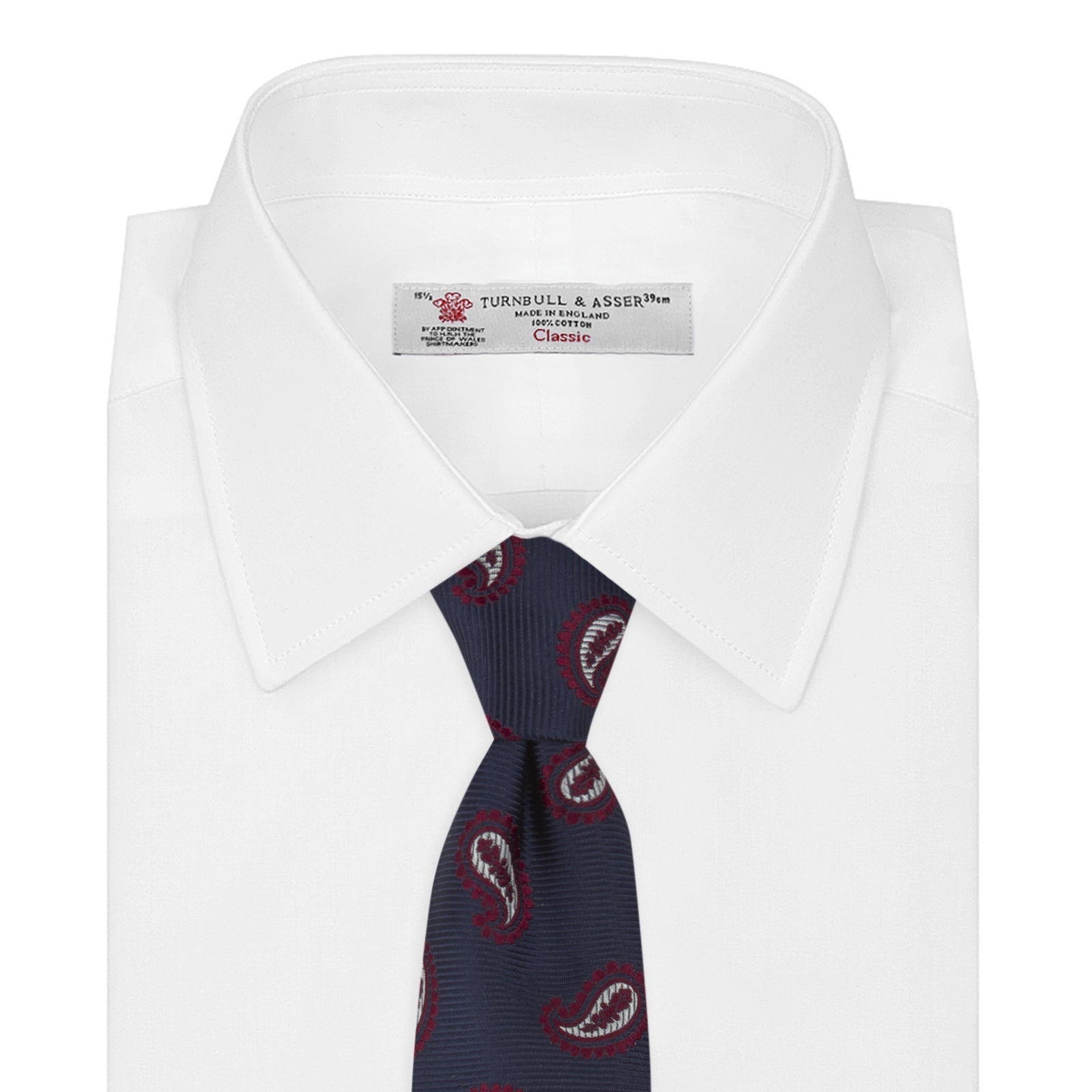 View 2 of product The Turnbull & Asser Navy and Burgundy Floating Paisley Silk Tie is shown rolled up, displaying its repeating paisley design on a plain white background.