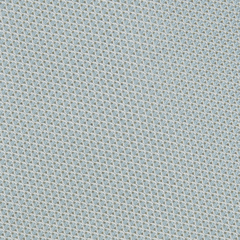 A neatly rolled Turnbull & Asser Light Blue Grenadine Silk Tie, featuring a subtle textured weave, displayed on a white background.
