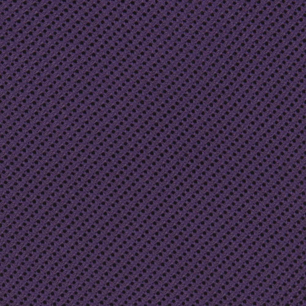 The Turnbull & Asser Plum Grenadine Silk Tie, featuring a textured grenadine weave, is shown rolled up on a plain white background.