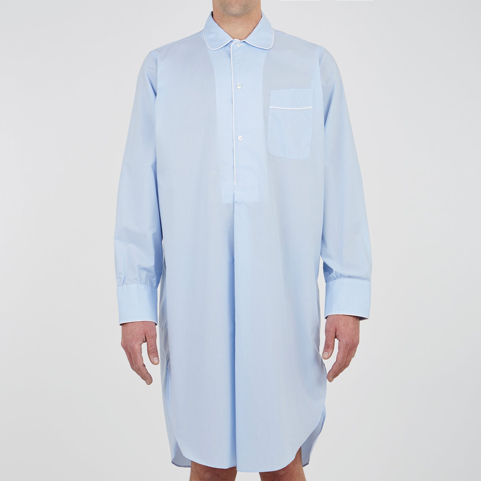 View 2 of product The Turnbull & Asser Sky Blue Micro-Check Cotton Nightshirt features white piping on the collar, button placket, and pocket, a subtle check pattern, and a visible label inside the collar.
