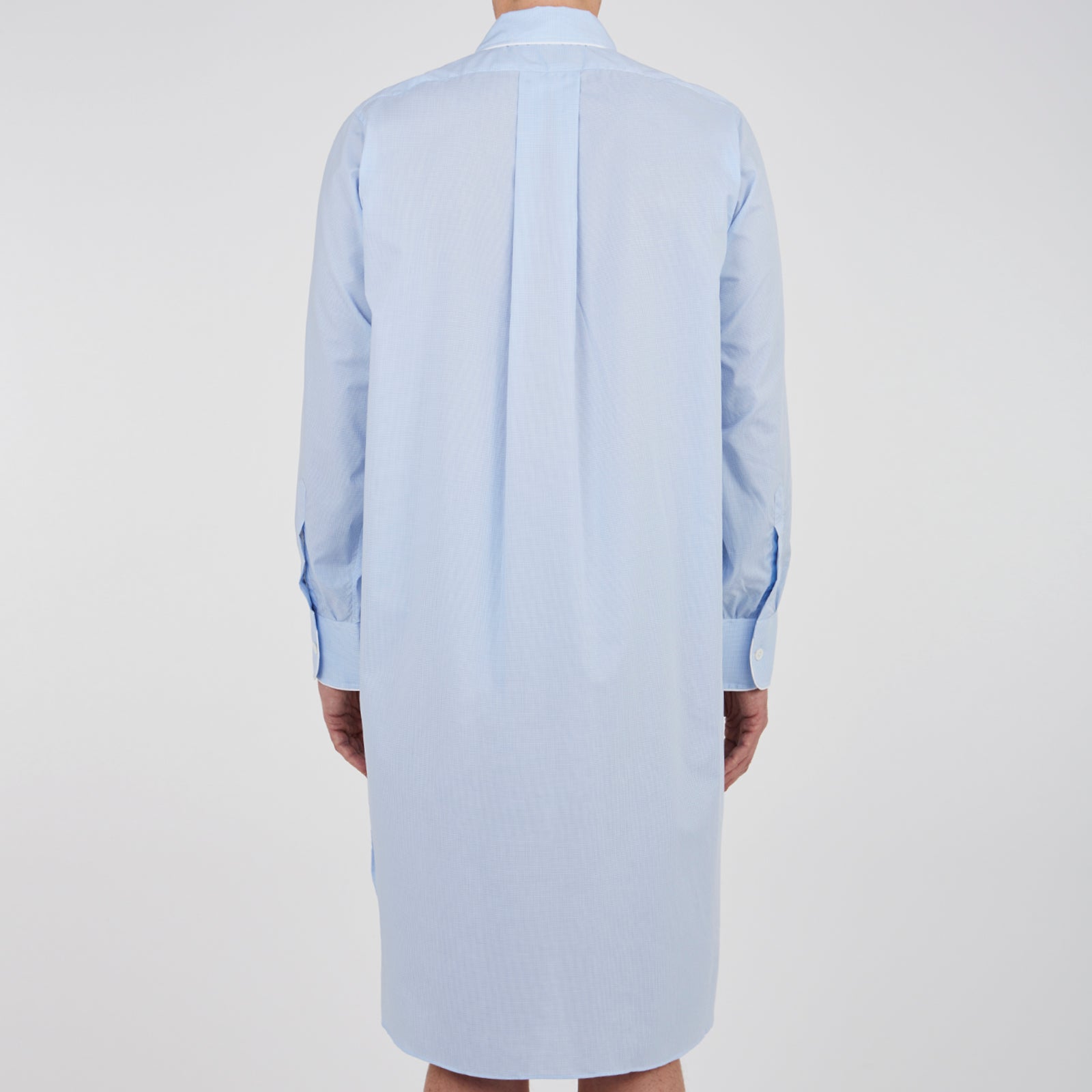 View 3 of product The Turnbull & Asser Sky Blue Micro-Check Cotton Nightshirt features white piping on the collar, button placket, and pocket, a subtle check pattern, and a visible label inside the collar.