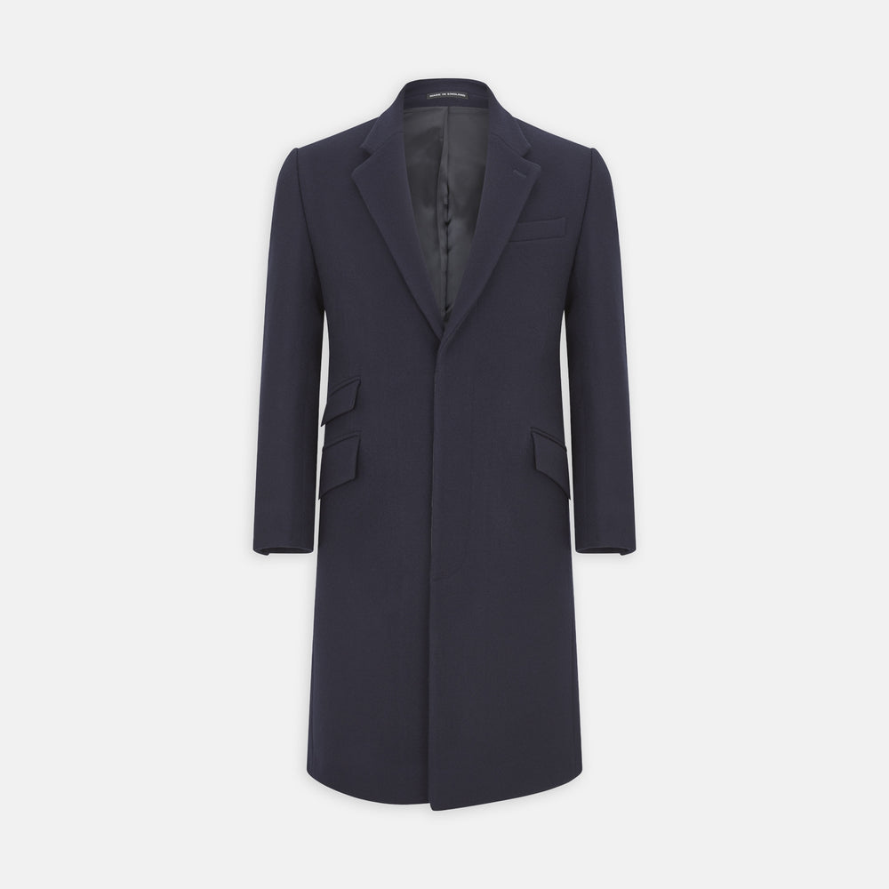 The Turnbull & Asser Navy Lambswool Joseph Overcoat, a men's knee-length coat with notched lapels, a single-breasted front, and three flap pockets per side, is shown against a plain white background.