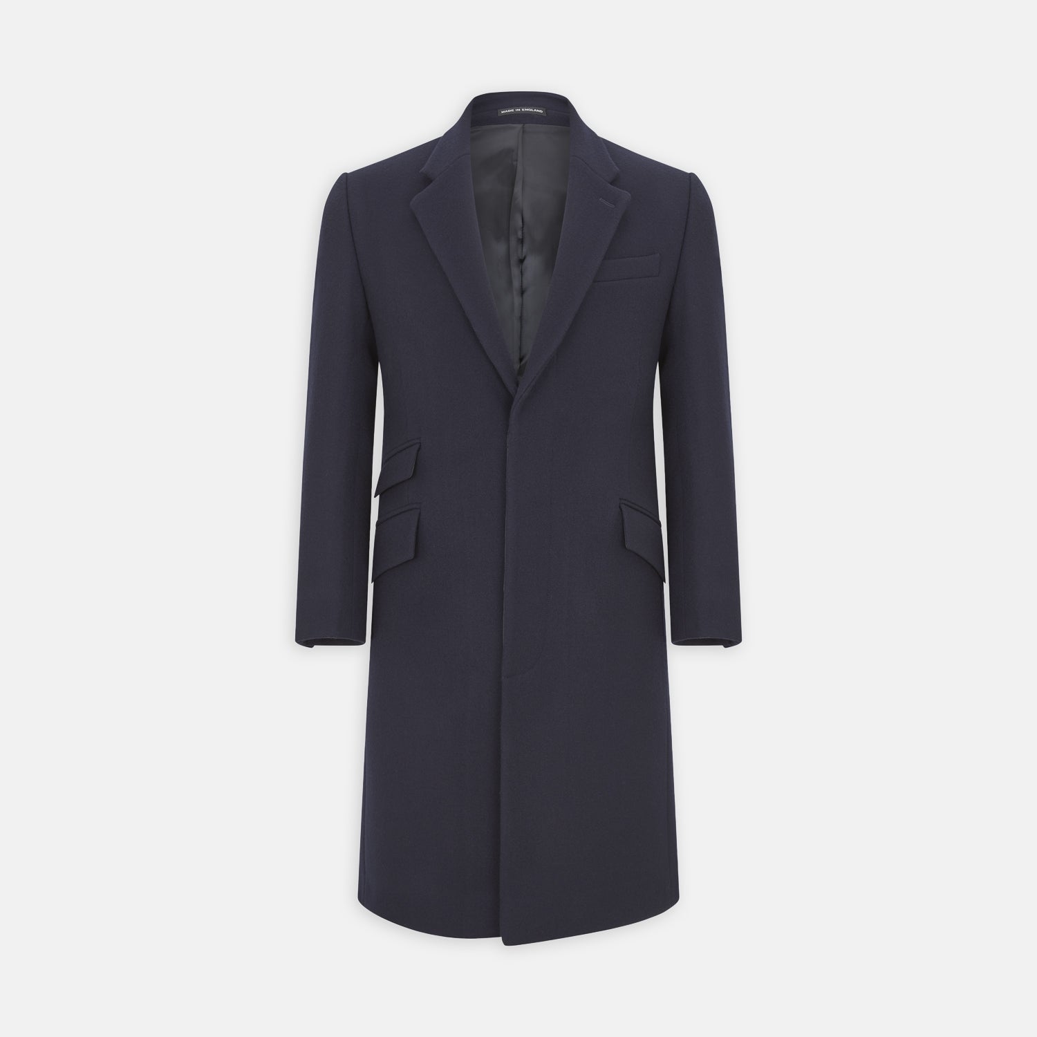 View 1 of product The Turnbull & Asser Navy Lambswool Joseph Overcoat, a men's knee-length coat with notched lapels, a single-breasted front, and three flap pockets per side, is shown against a plain white background.