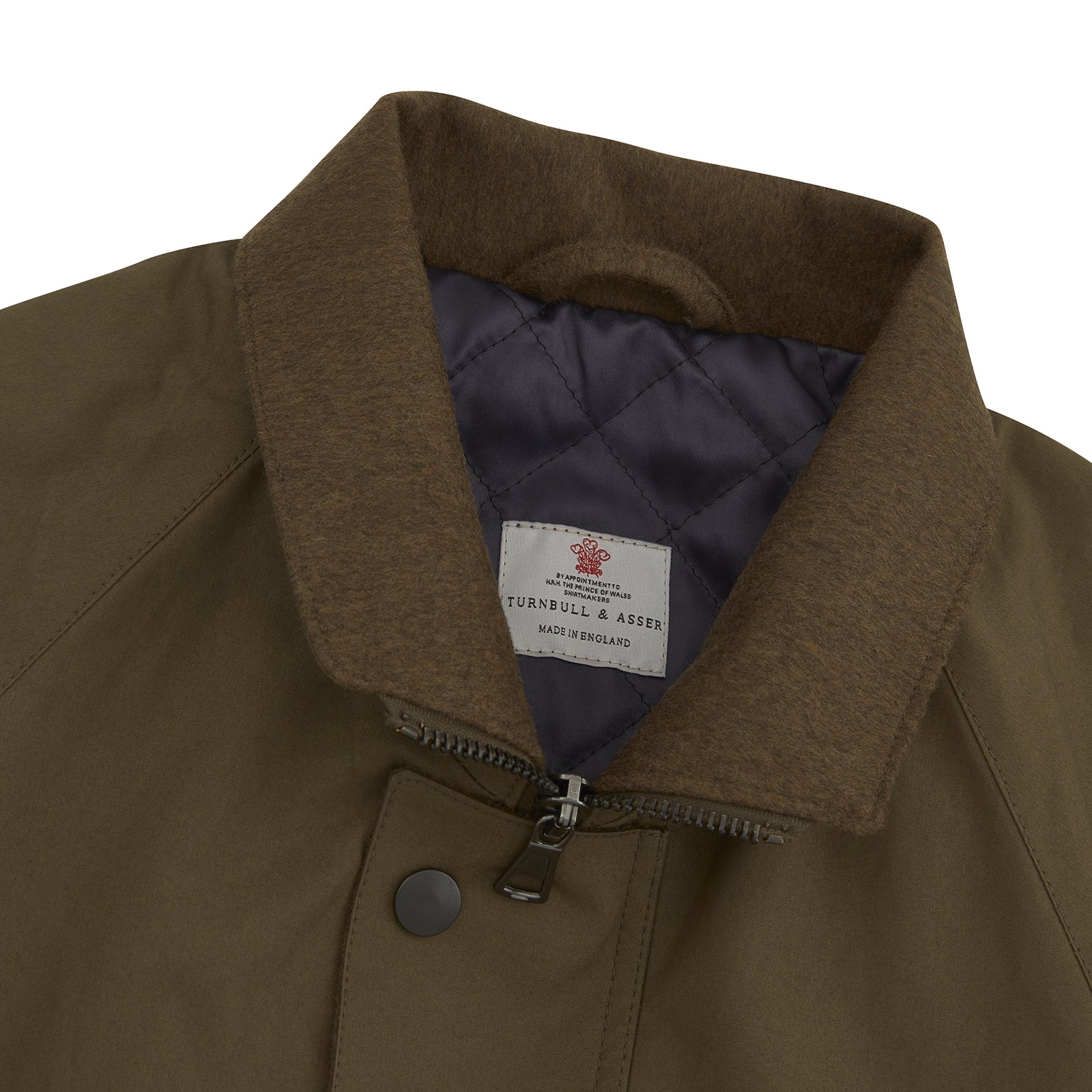 View 2 of product The Turnbull & Asser Dark Green Dry Wax Cotton Field Coat features a front zipper, snap buttons, two large flap pockets, two chest slant pockets, a stand collar, and a classic tailored design in durable dry wax cotton.
