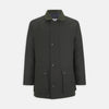 View 1 of product The Turnbull & Asser Dark Green Waxed Cotton Field Coat features a straight fit, button-up front, two large bottom flap pockets, slanted chest pockets, and a contrasting collar. Shown against a plain white background.