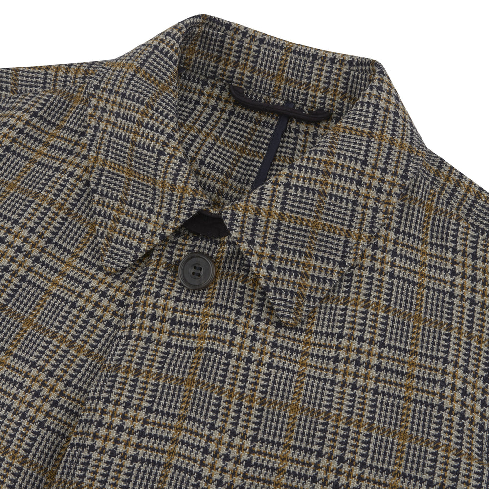 The Turnbull & Asser Checked Wool Car Coat features a straight-cut silhouette in brown and gray Prince of Wales check, classic collar, concealed front buttons, long sleeves, and a minimalist tailored design.