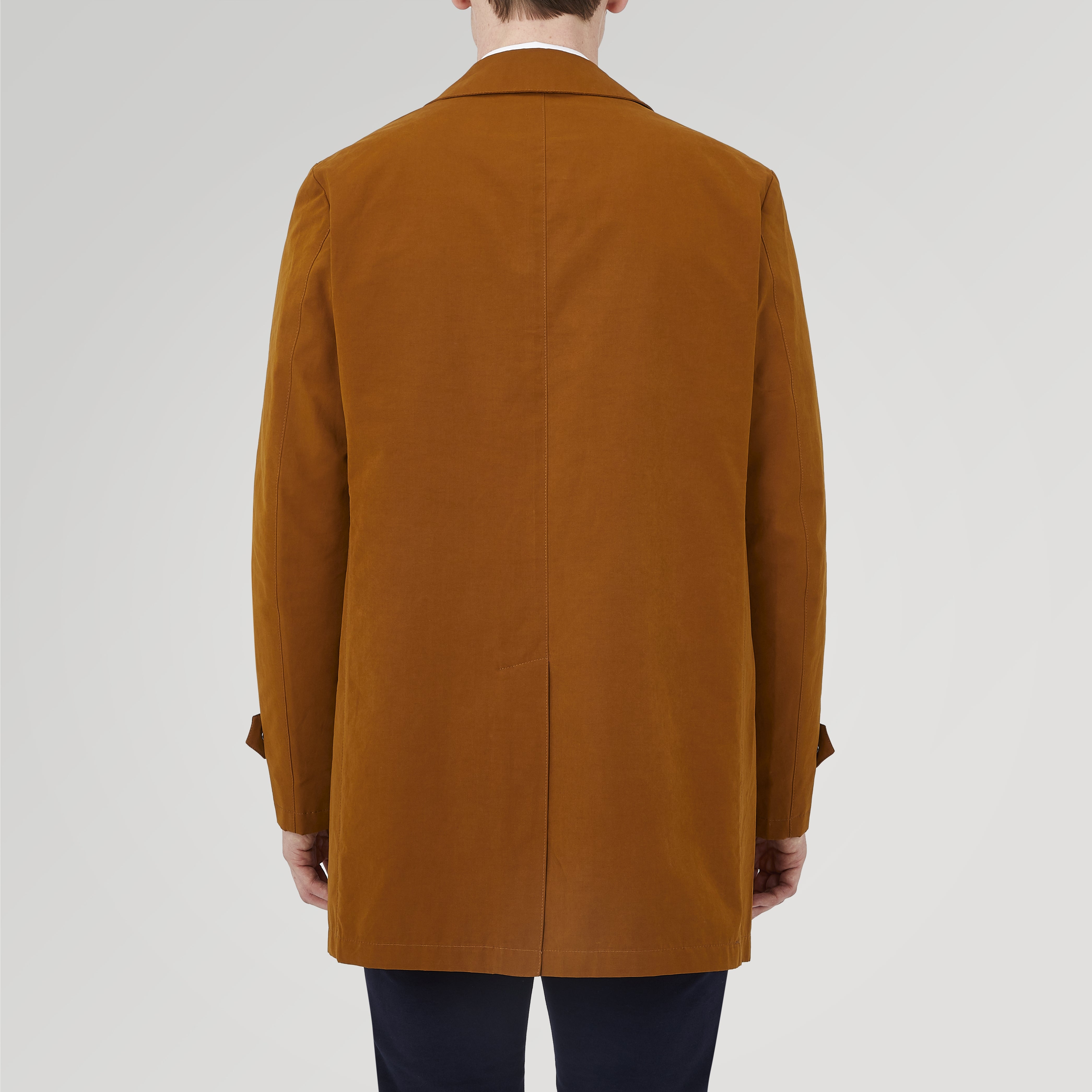 View 3 of product The Turnbull & Asser Dark Khaki Cotton Car Coat features a classic collar, long sleeves, front welt pockets, tailored fit, and concealed button closure in a knee-length modern design, shown against a plain white background.
