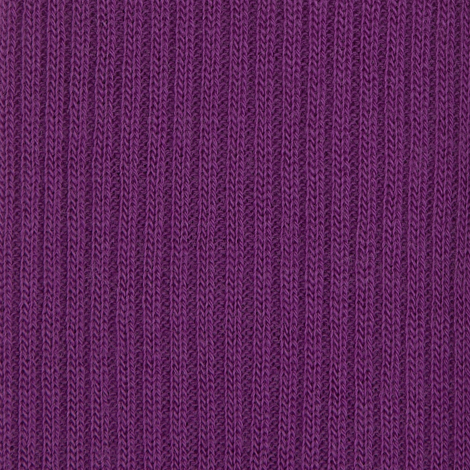 View 2 of product A single Magenta Long Merino Wool Sock by Turnbull & Asser is displayed side-on against a neutral background, showcasing its ribbed design, visible foot and calf, and representing the comfort and style of luxury men's socks.