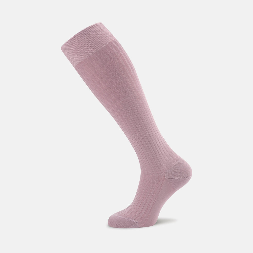 The Turnbull & Asser Dusky Pink Long Cotton Sock, crafted from premium Fil d’Ecosse Egyptian cotton with a ribbed texture, is shown standing upright on a white background in a side view.