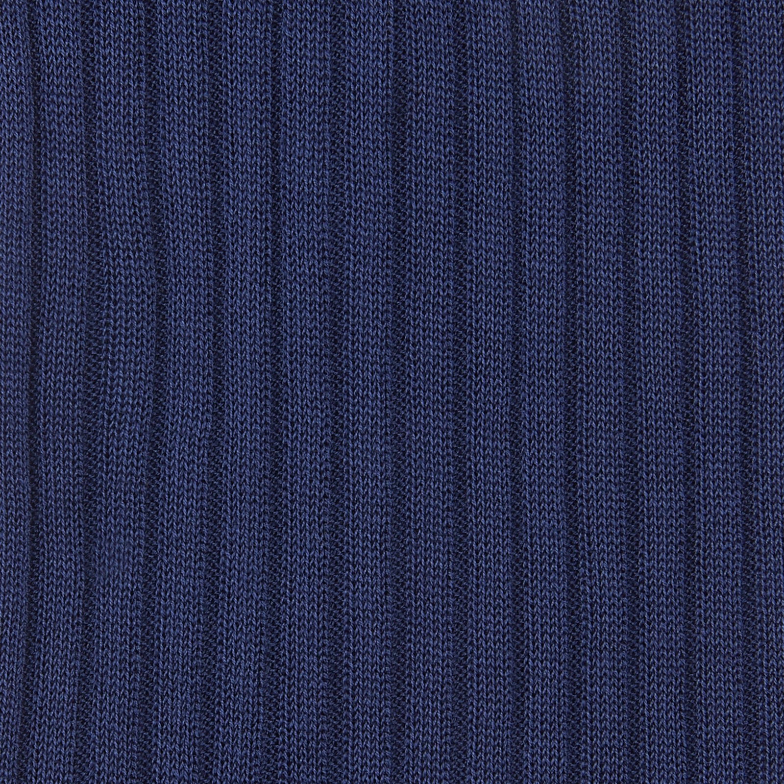 View 2 of product A single Ocean Blue Long Cotton Sock by Turnbull & Asser is shown on a white background, angled as if worn, highlighting its ribbed texture and elastic cuff at the top.