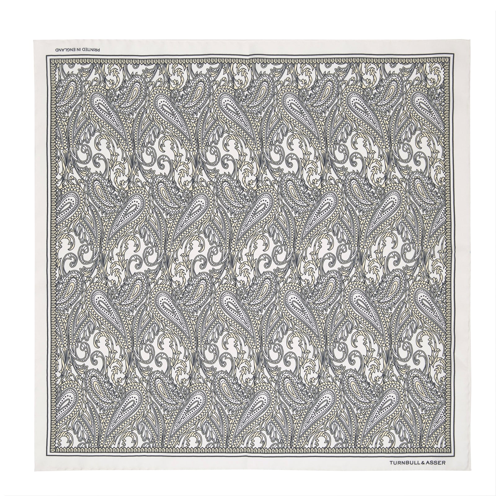 View 2 of product A White and Yellow House Paisley Silk Pocket Square by Turnbull & Asser, featuring an elegant house paisley pattern and the brand name printed in the bottom right corner.