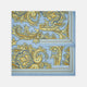 A folded Light Blue and Yellow Large Paisley Silk Pocket Square by Turnbull & Asser features an intricate paisley design. The brand name appears in white on the bottom right corner.