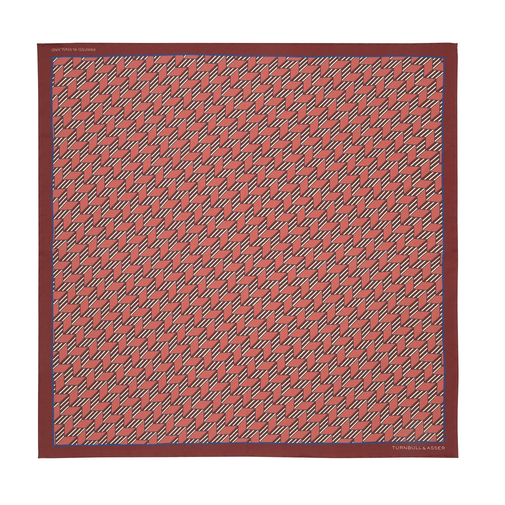 The Turnbull & Asser Red and Pink Arrow Silk Pocket Square features a striking pattern and luxurious silk, perfect for adding elegance to any look.