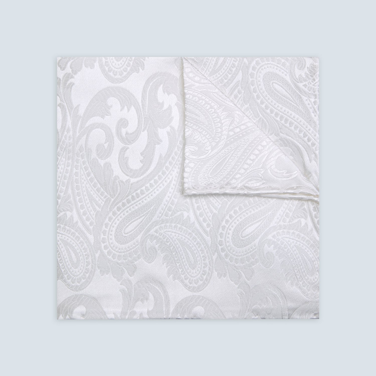 View 1 of product The Turnbull & Asser White House Paisley Hand-Rolled Silk Pocket Square is shown neatly folded to reveal both sides of its white woven fabric, ideal for black tie, set against a light gray background.