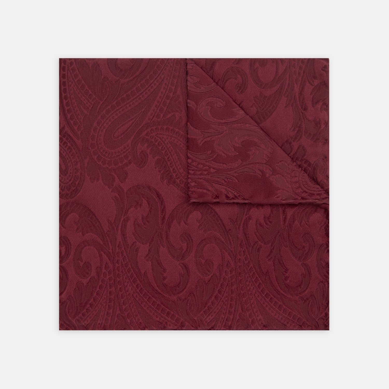 View 1 of product The Turnbull & Asser Burgundy House Paisley Hand-Rolled Silk Pocket Square features elegant paisley silk, expertly hand-rolled edges, and a classic fold—ideal for elevating black tie attire.