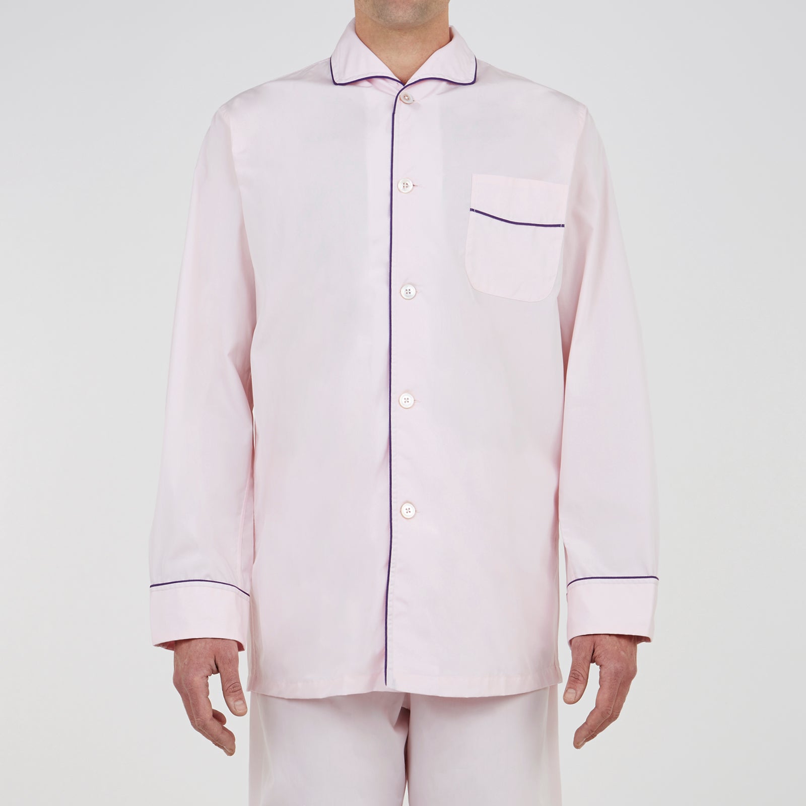 View 2 of product The Turnbull & Asser Pink Piped Cotton Pyjama Set, featuring dark piping on the collar and front with matching pants, is elegantly displayed on a white background—a luxurious sleepwear choice.