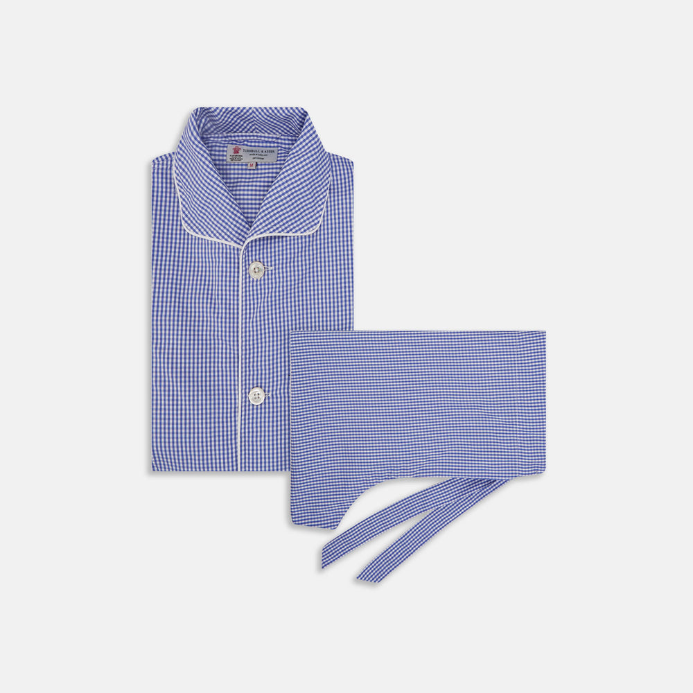 The Turnbull & Asser Mid Blue Gingham Check Piped Cotton Pyjama Set features white piping, two buttons, and a matching fabric belt, displayed on a white background—ideal for lovers of classic luxury sleepwear.