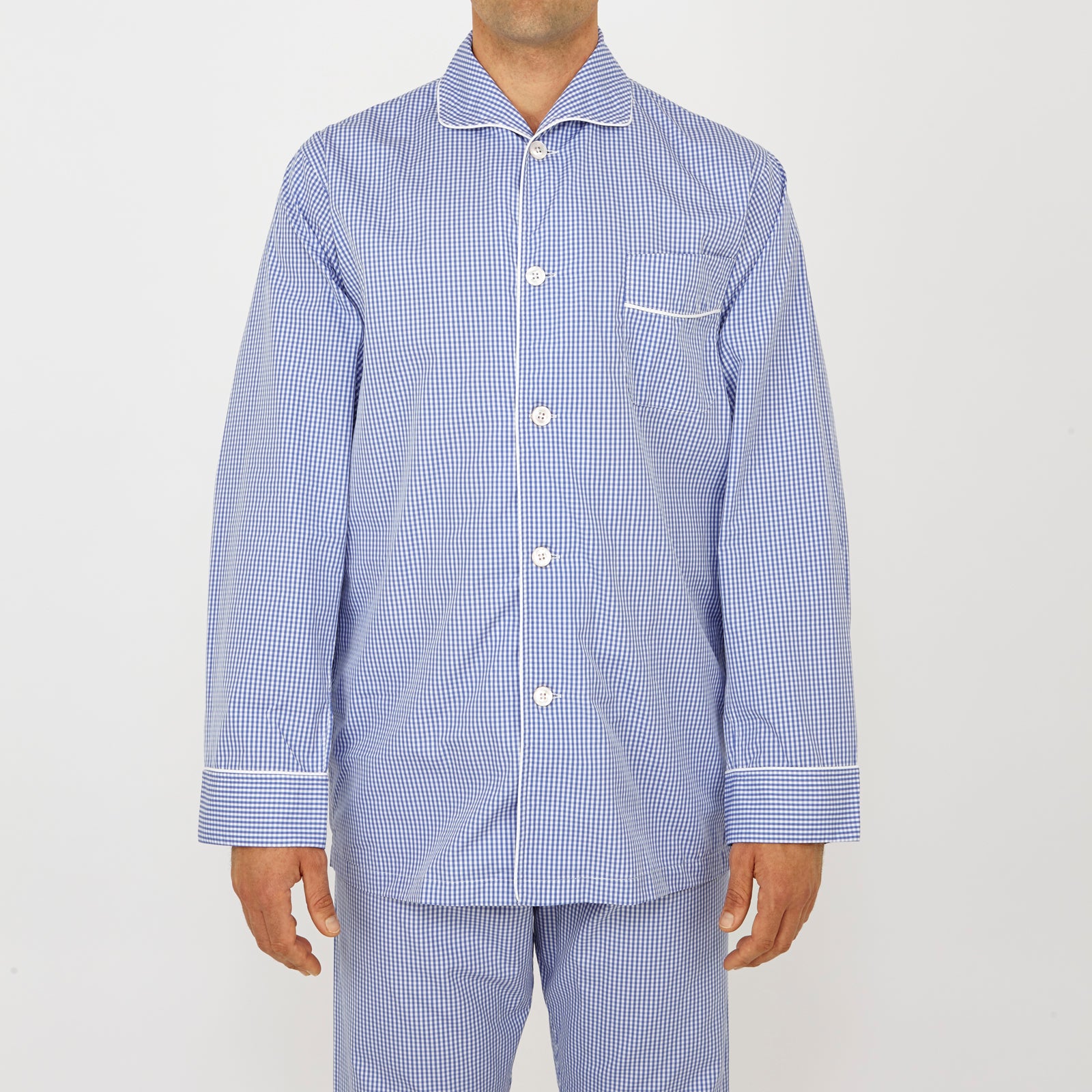 View 2 of product The Turnbull & Asser Mid Blue Gingham Check Piped Cotton Pyjama Set features white piping, two buttons, and a matching fabric belt, displayed on a white background—ideal for lovers of classic luxury sleepwear.