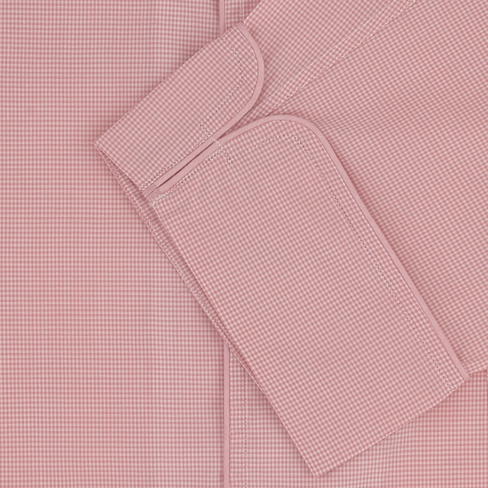 The Turnbull & Asser Pink Micro-Check Piped Cotton Pyjama Set, featuring a pink button-up top with white buttons and a matching headscarf, is displayed on a white background.