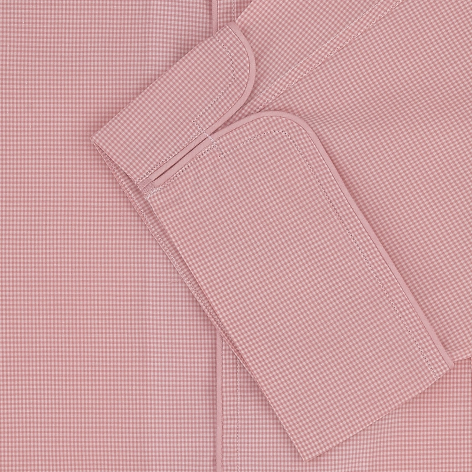 View 2 of product The Turnbull & Asser Pink Micro-Check Piped Cotton Pyjama Set, featuring a pink button-up top with white buttons and a matching headscarf, is displayed on a white background.