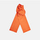The Turnbull & Asser Orange and White Spotted Silk Scarf, featuring white polka dots and fringed edges, is neatly folded and displayed on a plain light gray background.
