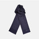 The Navy and White Spotted Silk Scarf by Turnbull & Asser features a hand-printed polka dot design and fringed edges, neatly folded and displayed on a plain white background.