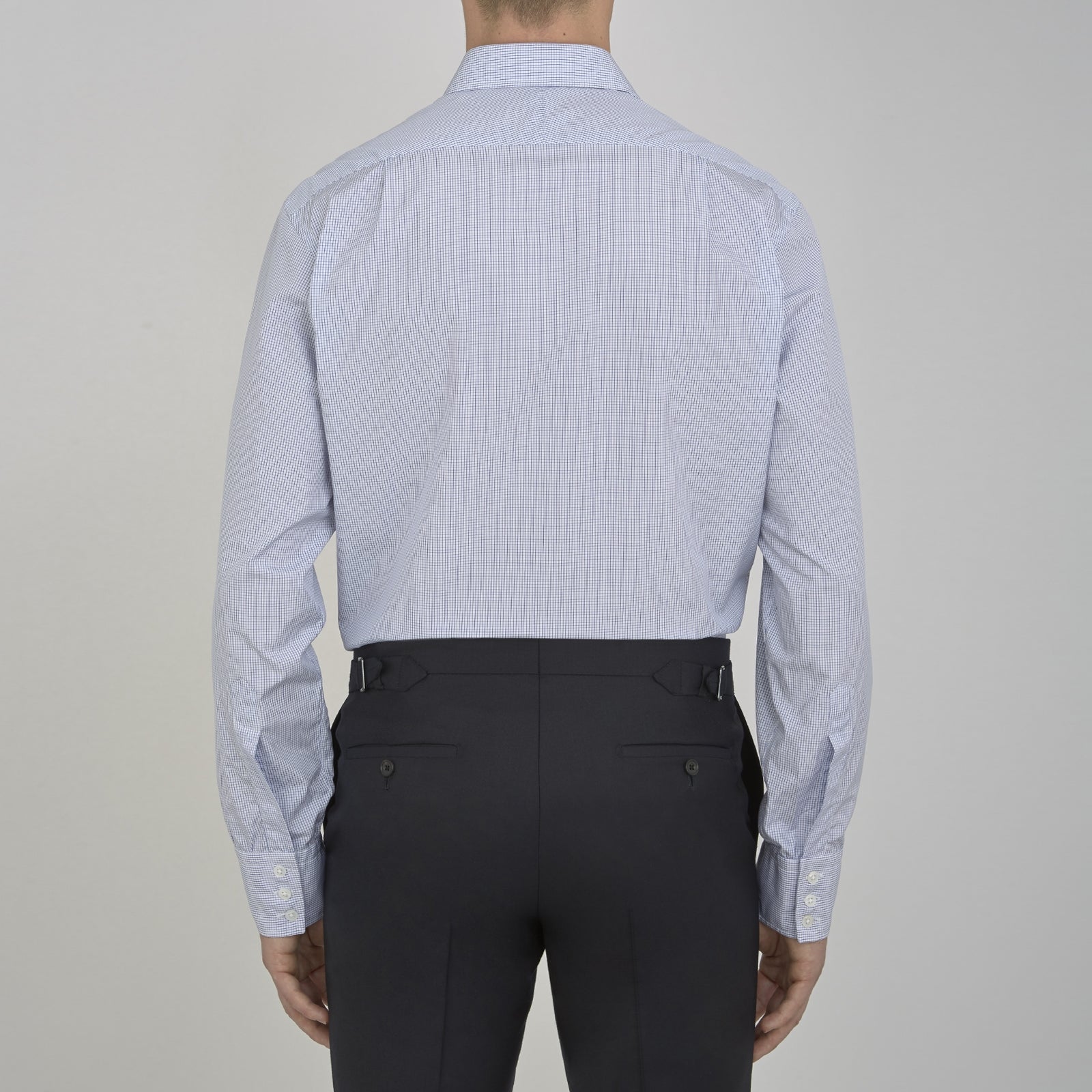 View 3 of product The Turnbull & Asser Blue Grid Check Shirt features a T&A collar, 3-button cuffs, and a refined blue and white grid pattern, displayed against a white background.