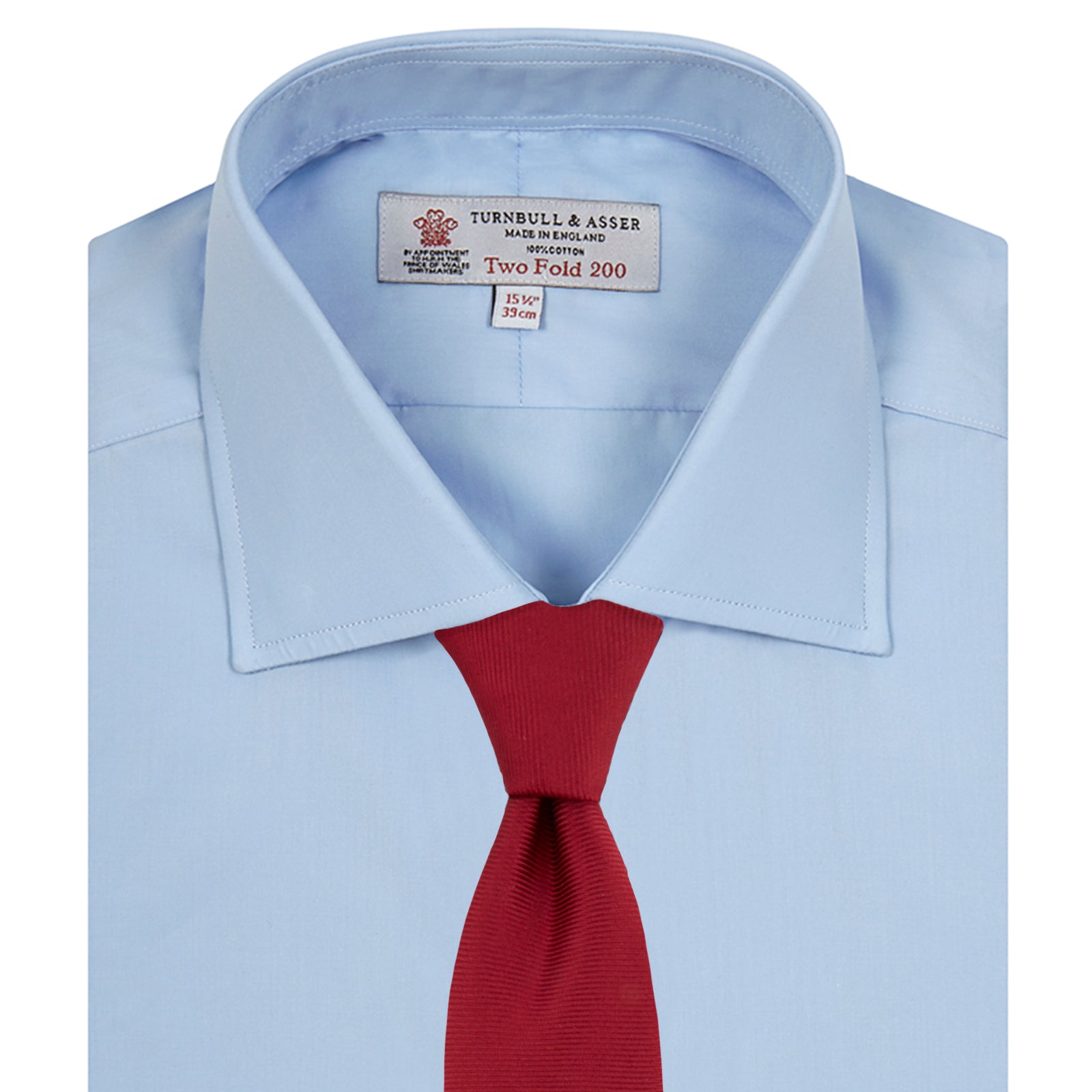 View 4 of product A neatly folded Burgundy Corduroy Cotton Shirt by Turnbull & Asser, featuring a Cambridge collar and 3-button cuffs, displayed against a plain white background.