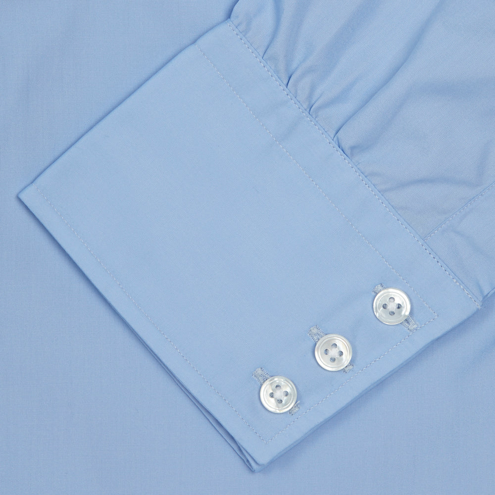 A neatly folded Burgundy Corduroy Cotton Shirt by Turnbull & Asser, featuring a Cambridge collar and 3-button cuffs, displayed against a plain white background.