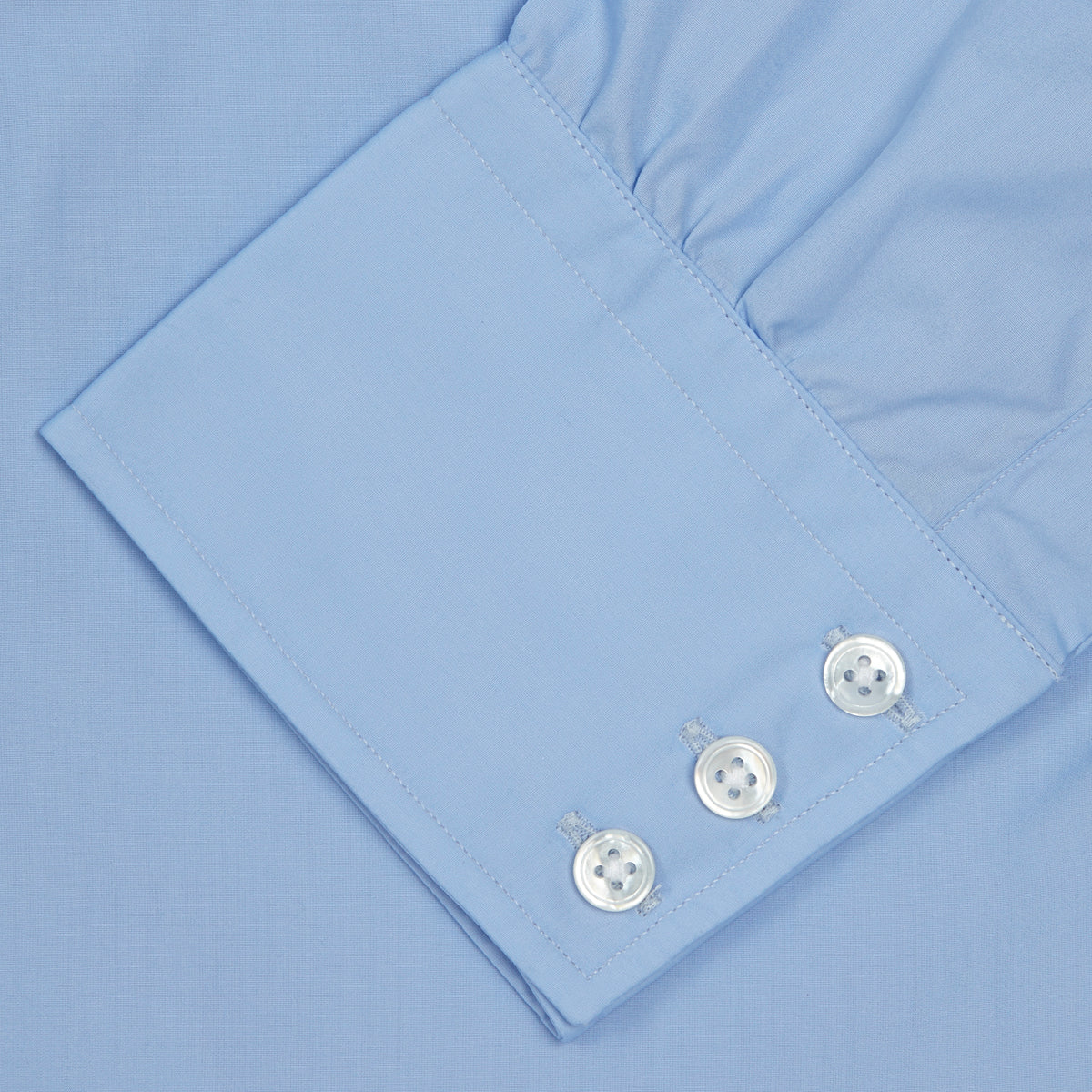 View 6 of product A neatly folded Burgundy Corduroy Cotton Shirt by Turnbull & Asser, featuring a Cambridge collar and 3-button cuffs, displayed against a plain white background.