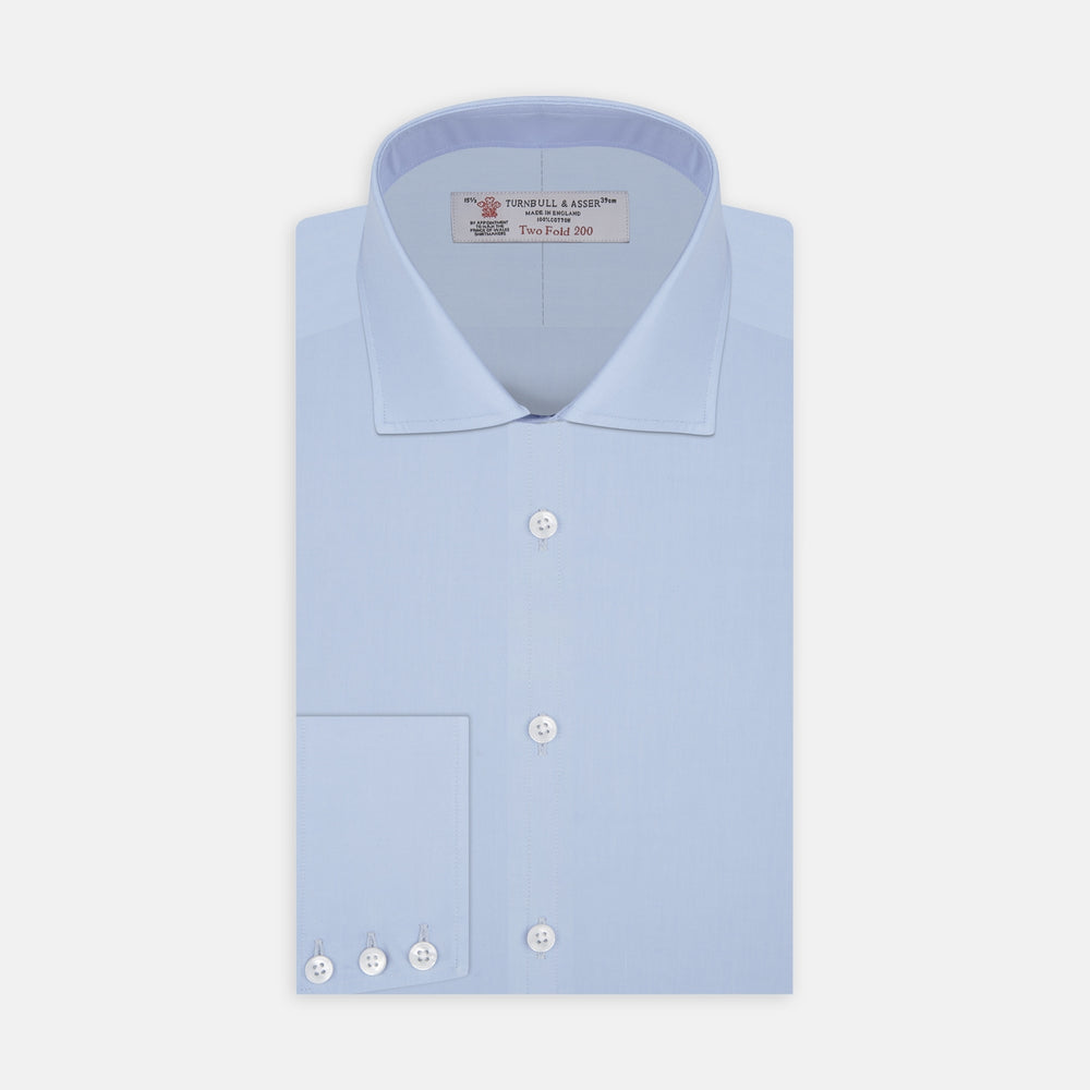 A neatly folded Burgundy Corduroy Cotton Shirt by Turnbull & Asser, featuring a Cambridge collar and 3-button cuffs, displayed against a plain white background.