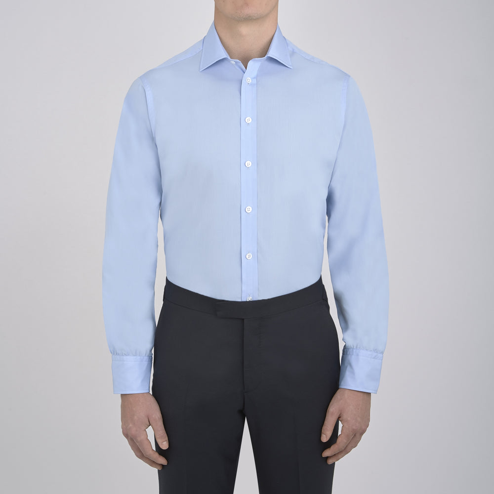A neatly folded Burgundy Corduroy Cotton Shirt by Turnbull & Asser, featuring a Cambridge collar and 3-button cuffs, displayed against a plain white background.