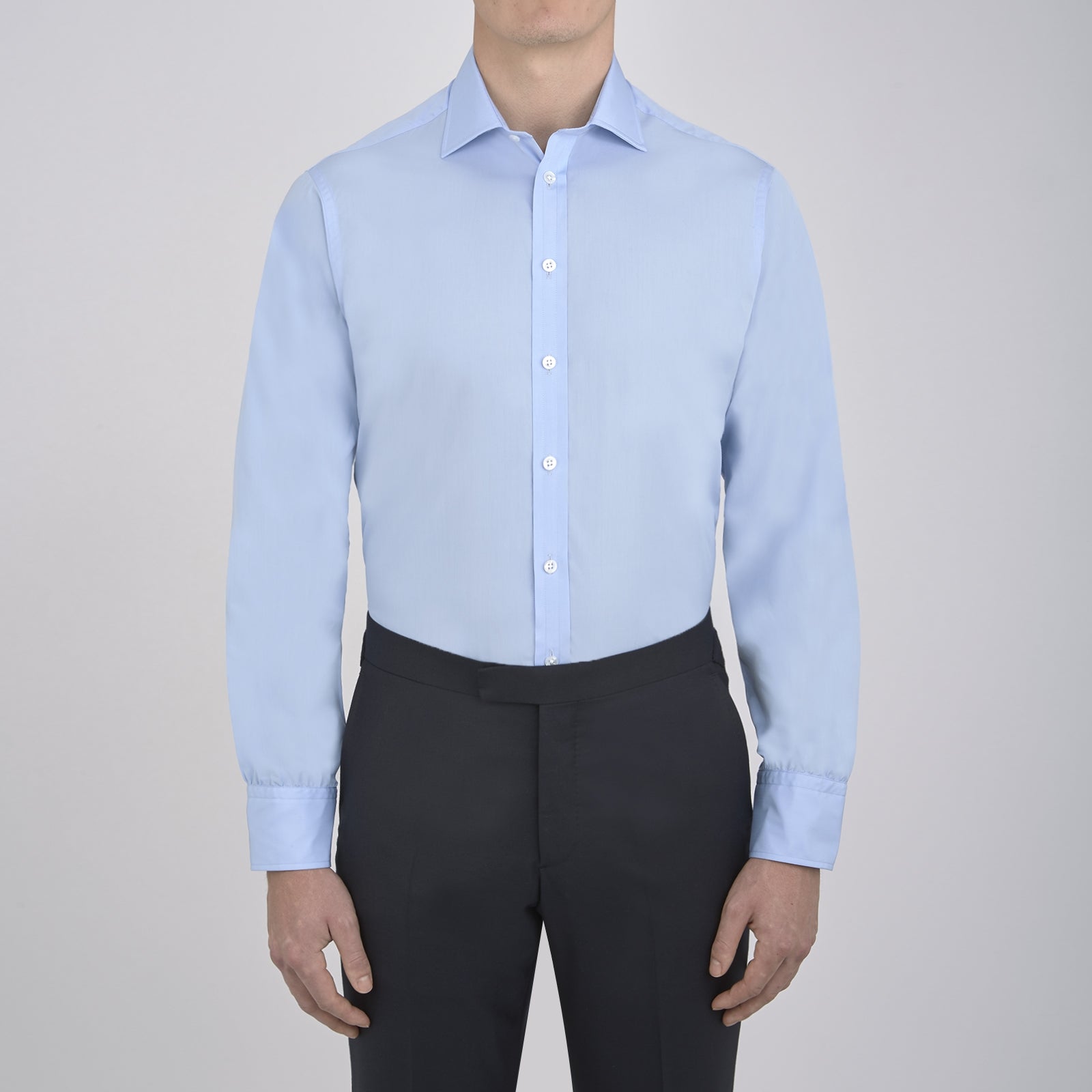 View 2 of product A neatly folded Burgundy Corduroy Cotton Shirt by Turnbull & Asser, featuring a Cambridge collar and 3-button cuffs, displayed against a plain white background.