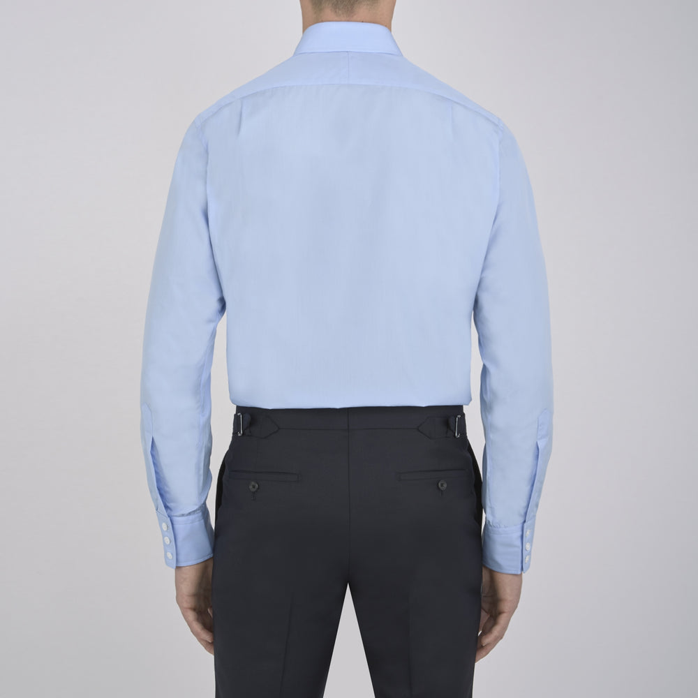 A neatly folded Burgundy Corduroy Cotton Shirt by Turnbull & Asser, featuring a Cambridge collar and 3-button cuffs, displayed against a plain white background.