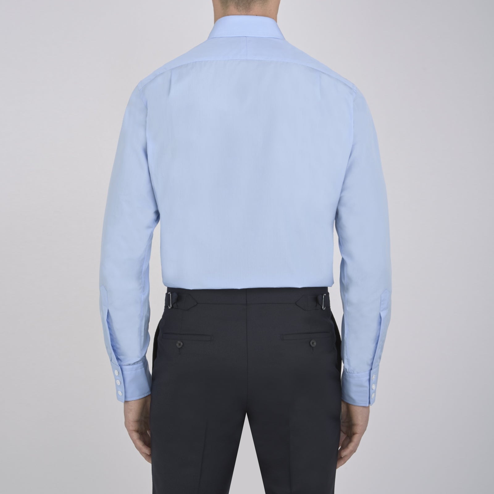 View 3 of product A neatly folded Burgundy Corduroy Cotton Shirt by Turnbull & Asser, featuring a Cambridge collar and 3-button cuffs, displayed against a plain white background.