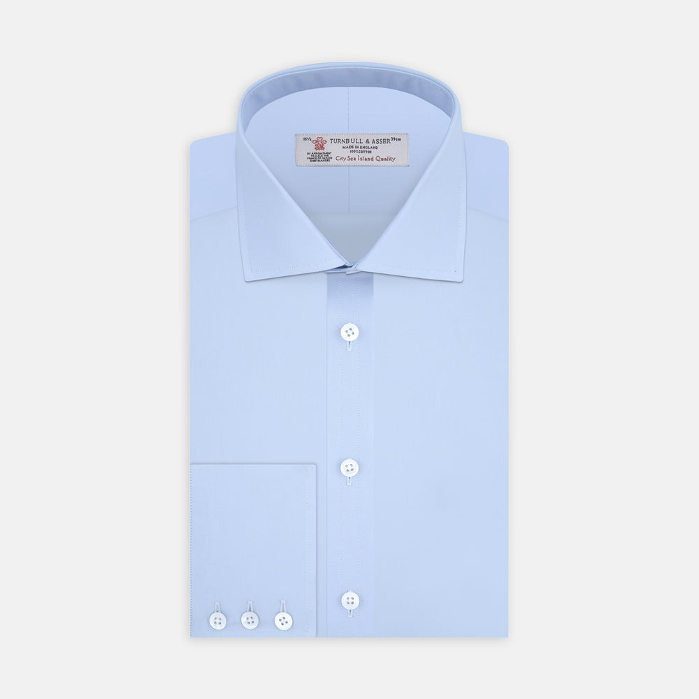 The Turnbull & Asser Blue Sea Island Quality Cotton Shirt features a Dr. No collar and button cuffs, crafted from fine cotton and shown neatly folded on a plain white background.