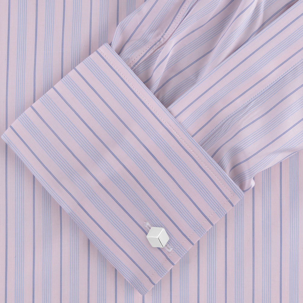 The Pink and Blue Mixed Stripe Shirt by Turnbull & Asser features a T&A collar, double cuffs, and white buttons—perfect for fans of colourful shirts—shown neatly folded against a plain white background.