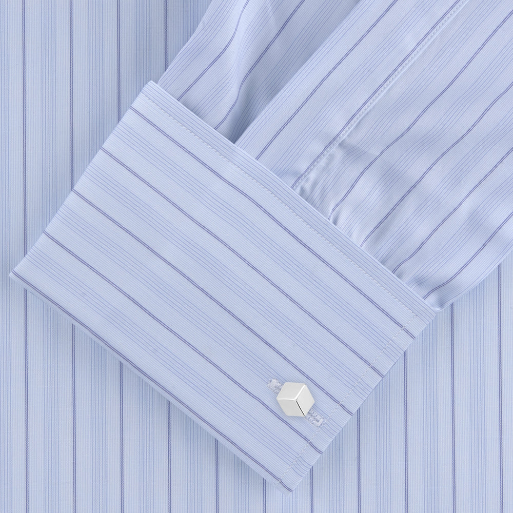 The Turnbull & Asser Blue Mixed Stripe Shirt with T&A Collar and Double Cuffs, ideal for striped shirt enthusiasts, is neatly folded and displayed against a plain white background.
