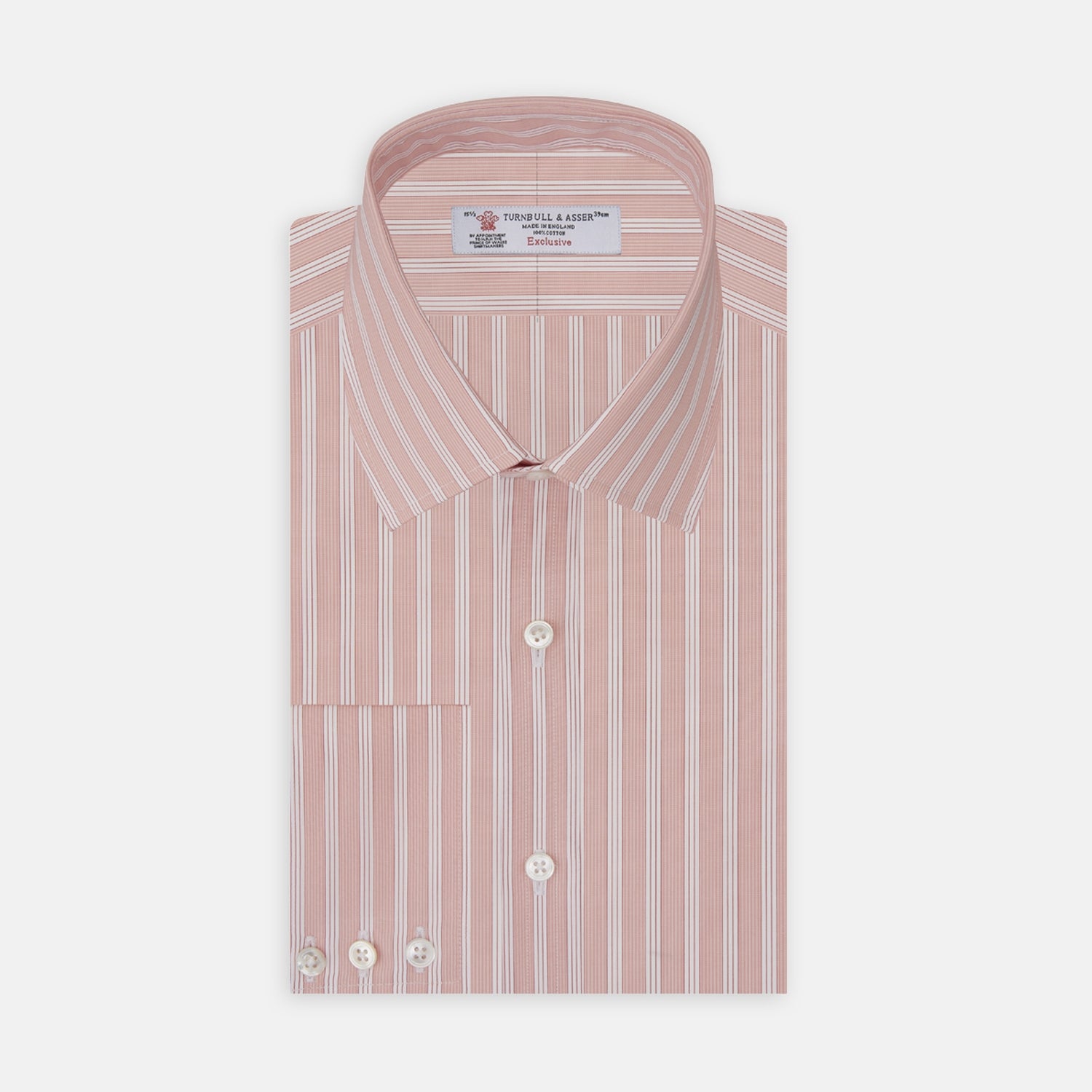View 1 of product The Turnbull & Asser Pink and White Bold Stripe Shirt features a T&A collar, long sleeves, 3-button cuffs, and striking vertical stripes. The shirt is displayed folded with white buttons against a white background.